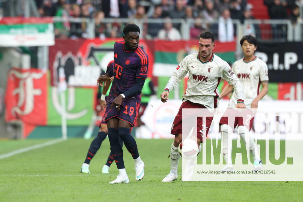 Alphonso Davies, FC Bayern Munich, 19, with Arijon Ibrahimovic, FC Augsburg, 21, GER, FC Augsburg vs. FC Bayern Munich, Soccer, Bundesliga, Matchday 5, 2026–2027 Season, October 10, 2026, DFL and DFB regulations prohibit any use of photographs as image sequences and or quasi-video, GER, FC Augsburg vs. FC Bayern Munich, soccer, Bundesliga, Matchday 5, 2026–2027 season, October 10, 2026, Augsburg