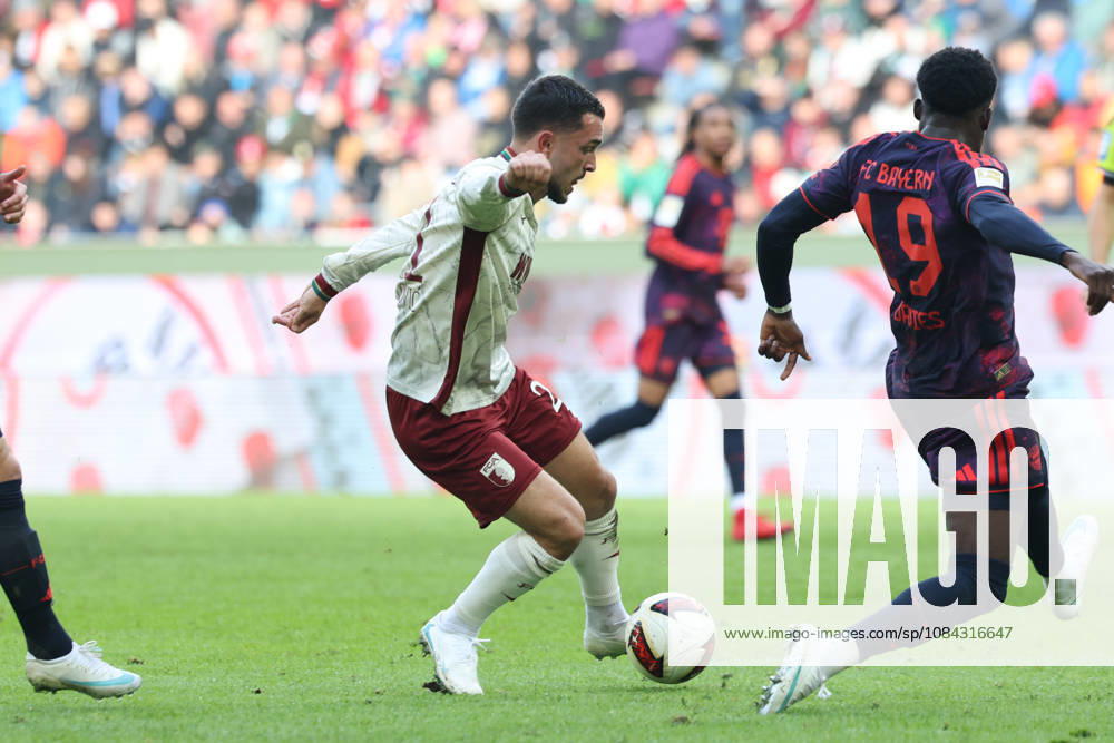 Arijon Ibrahimovic, FC Augsburg, 21, with Alphonso Davies, FC Bayern Munich, 19, GER, FC Augsburg vs. FC Bayern Munich, Soccer, Bundesliga, Matchday 5, 2026–2027 Season, October 10, 2026, DFL and DFB regulations prohibit any use of photographs as image sequences and or quasi-video, GER, FC Augsburg vs. FC Bayern Munich, soccer, Bundesliga, Matchday 5, 2026–2027 season, October 10, 2026, Augsburg