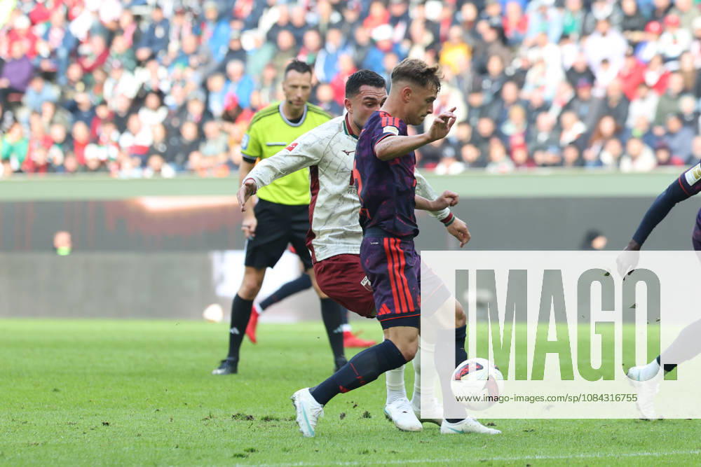 Joshua Kimmich, FC Bayern Munich, 06, with Arijon Ibrahimovic, FC Augsburg, 21, GER, FC Augsburg vs. FC Bayern Munich, Soccer, Bundesliga, Matchday 5, 2026–2027 Season, October 10, 2026, DFL and DFB regulations prohibit any use of photographs as image sequences and or quasi-video, GER, FC Augsburg vs. FC Bayern Munich, soccer, Bundesliga, Matchday 5, 2026–2027 season, October 10, 2026, Augsburg