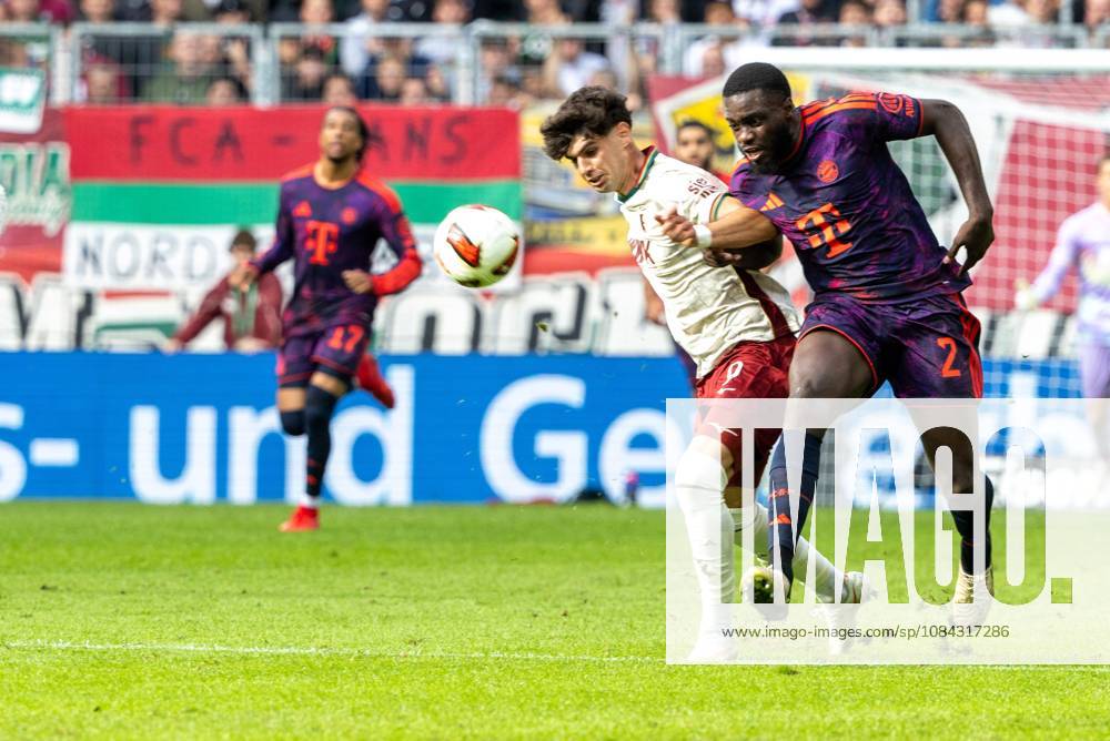 Rodrigo Ribeiro (FC Augsburg) and Dayot Upamecano (FC Bayern Munich) in a tackle, FC Augsburg vs. FC Bayern Munich, Bundesliga, Soccer, Bundesliga 1, Matchday 5, October 10, 2026. DFL regulations prohibit any use of photographs as image sequences and or quasi-video.