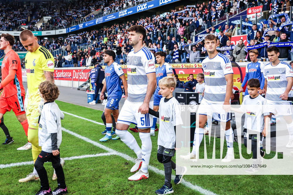 Sports, Soccer, 3rd Division, 2026–2027 Season, Matchday 8: MSV Duisburg vs. TSG 1899 Hoffenheim II, October 10, 2026, Schauinsland Reisen Arena, Max Braune, MSV Duisburg, 1 Tobias Fleckstein, MSV Duisburg; 5 Ben Schlicke, MSV Duisburg; 40 fans at the player entrance, Duisburg, Schauinsland Reisen Arena, North Rhine-Westphalia, Germany