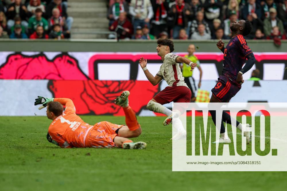 Rodrigo Ribeiro (9, FC Augsburg) scores the goal to make it 2–1; Manuel Neuer (1, FC Bayern Munich); Alphonso Davies (19, FC Bayern Munich); FC Augsburg vs. FC Bayern Munich; soccer; Bundesliga 1, Matchday 5, October 10, 2026. DFB and DFL regulations prohibit any use of photographs as image sequences and or quasi-video. Augsburg, Bayern, Germany