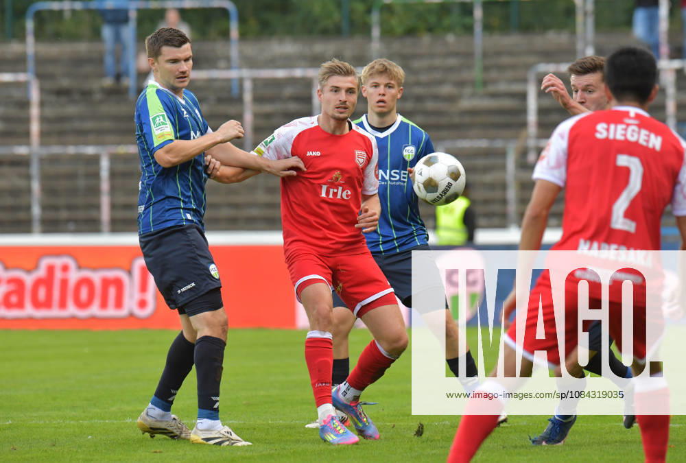 GER, Soccer, Regionalliga West, 2026–2027 Season, Matchday 12, Ohlendorf Stadium in Heidewald, Gütersloh FC vs. SF Siegen 0–5, Björn Rother (FC Gütersloh, left) vs. Elias Paul Huth (SF Siegen), action, duel, tackle