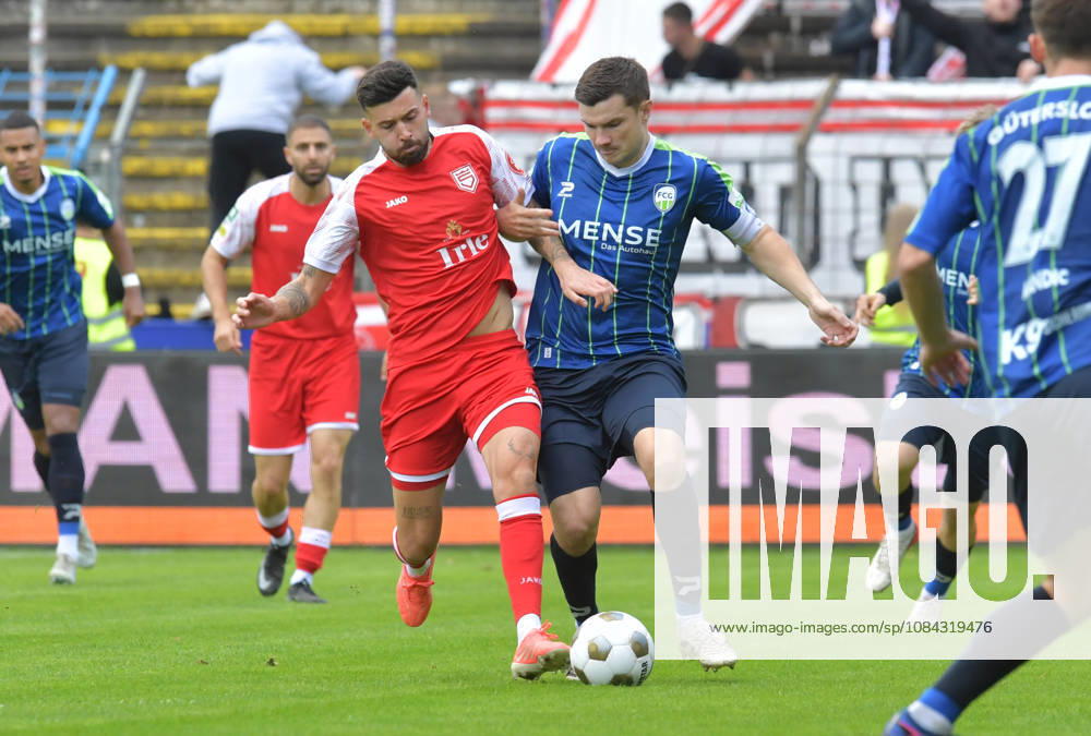 GER, Soccer, Regionalliga West, 2026–2027 Season, Matchday 12, Ohlendorf Stadium in Heidewald, Gütersloh FC vs. SF Siegen 0–5, Björn Rother (FC Gütersloh, right) vs. Dennis Brock (SF Siegen), action, duel, tackle