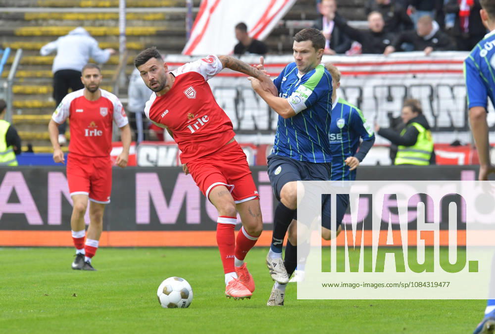 GER, Soccer, Regionalliga West, 2026–2027 Season, Matchday 12, Ohlendorf Stadium in Heidewald, Gütersloh FC vs. SF Siegen 0–5, Björn Rother (FC Gütersloh, right) vs. Dennis Brock (SF Siegen), action, duel, tackle