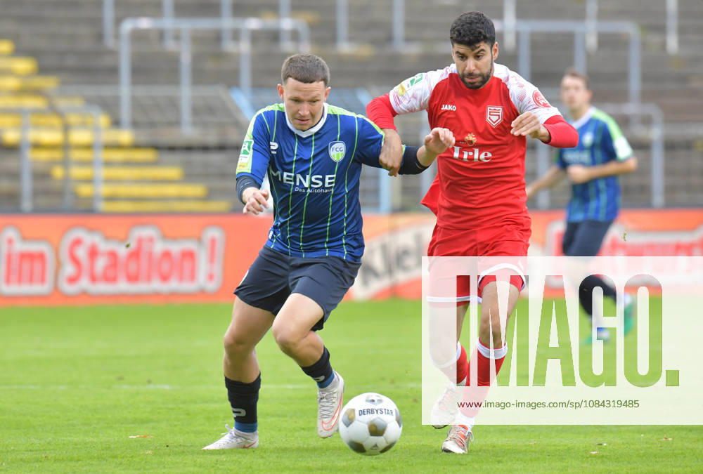 Germany, Soccer, Regionalliga West, 2026–2027 Season, Matchday 12, Ohlendorf Stadium in Heidewald, Gütersloh FC vs. SF Siegen 0–5, Phil Beckhoff (FC Gütersloh, left) vs. Hamza Saghiri (SF Siegen), action, duel, tackle