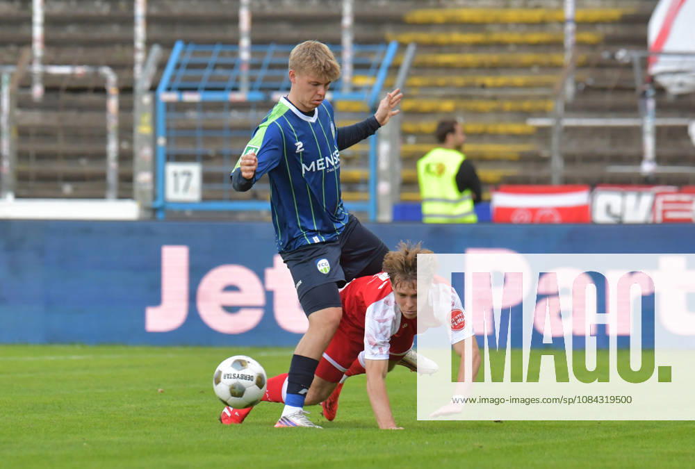 GER, Soccer, Regionalliga West, 2026–2027 Season, Matchday 12, Ohlendorf Stadium in Heidewald, Gütersloh FC vs. SF Siegen 0–5, Erik Lanfer (FC Gütersloh) (top) vs. Konstantin Gerhardt (SF Siegen), action, duel, tackle