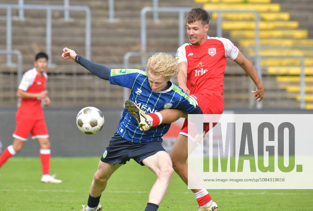 GER, Soccer, Regionalliga West, 2026–2027 Season, Matchday 12, Ohlendorf Stadium in Heidewald, Gütersloh FC vs. SF Siegen 0–5, Niklas Frese (FC Gütersloh, left) vs. Tim Arnold (SF Siegen), action, duel, tackle