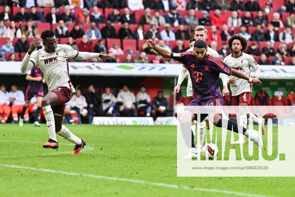 AUGSBURG, GERMANY; 10. OCTOBER: tackle between Ismael Abdulai Juma BAH (FC Augsburg 35) und Ismael SAIBARI (FC Bayern Munich 34) during the Bundesliga Match between FC Augsburg vs. FC Bayern Munich at Matchday 5 at WWK-Arena DFL REGULATIONS PROHIBIT ANY USE OF PHOTOGRAPHS AS IMAGE SEQUENCES AND OR QUASI-VIDEO