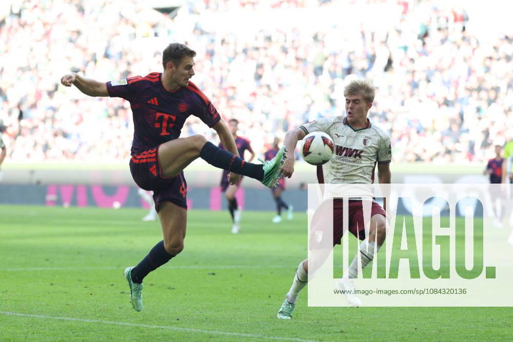Josip Stanisic, FC Bayern Munich, 44, with Hennes Behrens, FC Augsburg, 16, GER, FC Augsburg vs. FC Bayern Munich, Soccer, Bundesliga, Matchday 5, 2026–2027 Season, October 10, 2026, DFL and DFB regulations prohibit any use of photographs as image sequences and or quasi-video, GER, FC Augsburg vs. FC Bayern Munich, soccer, Bundesliga, Matchday 5, 2026–2027 season, October 10, 2026, Augsburg