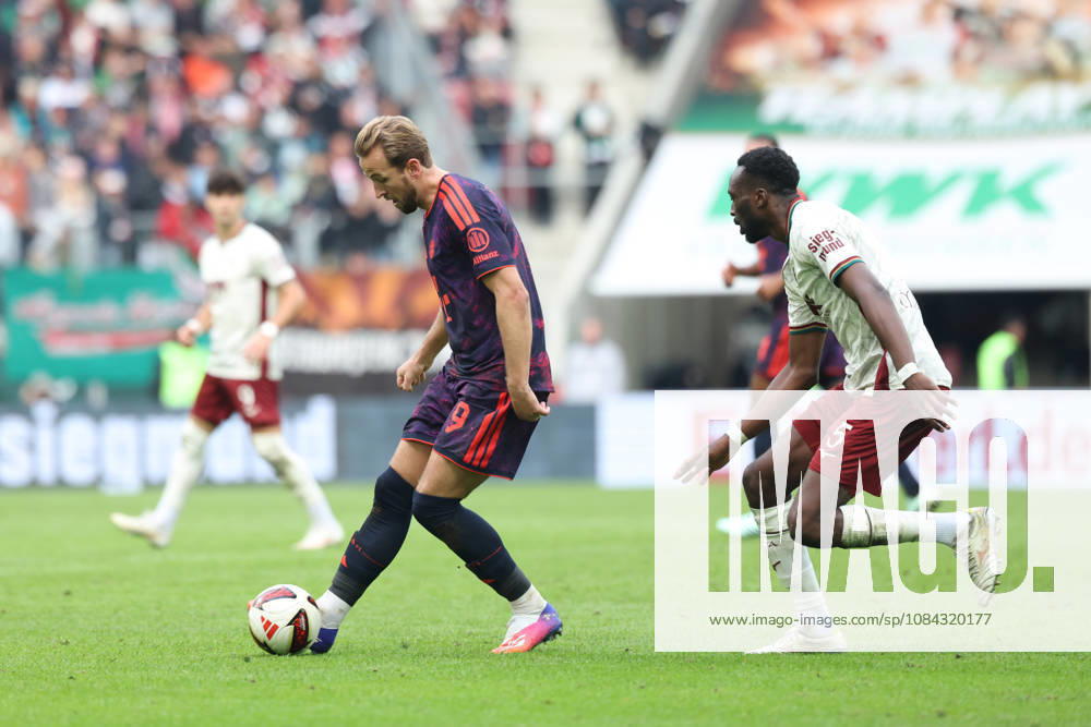Harry Kane, FC Bayern Munich, 09, with Chrislain Matsima, FC Augsburg, 05, GER, FC Augsburg vs. FC Bayern Munich, Soccer, Bundesliga, Matchday 5, 2026–2027 Season, October 10, 2026, DFL and DFB regulations prohibit any use of photographs as image sequences and or quasi-video, GER, FC Augsburg vs. FC Bayern Munich, Soccer, Bundesliga, Matchday 5, 2026–2027 season, October 10, 2026, Augsburg