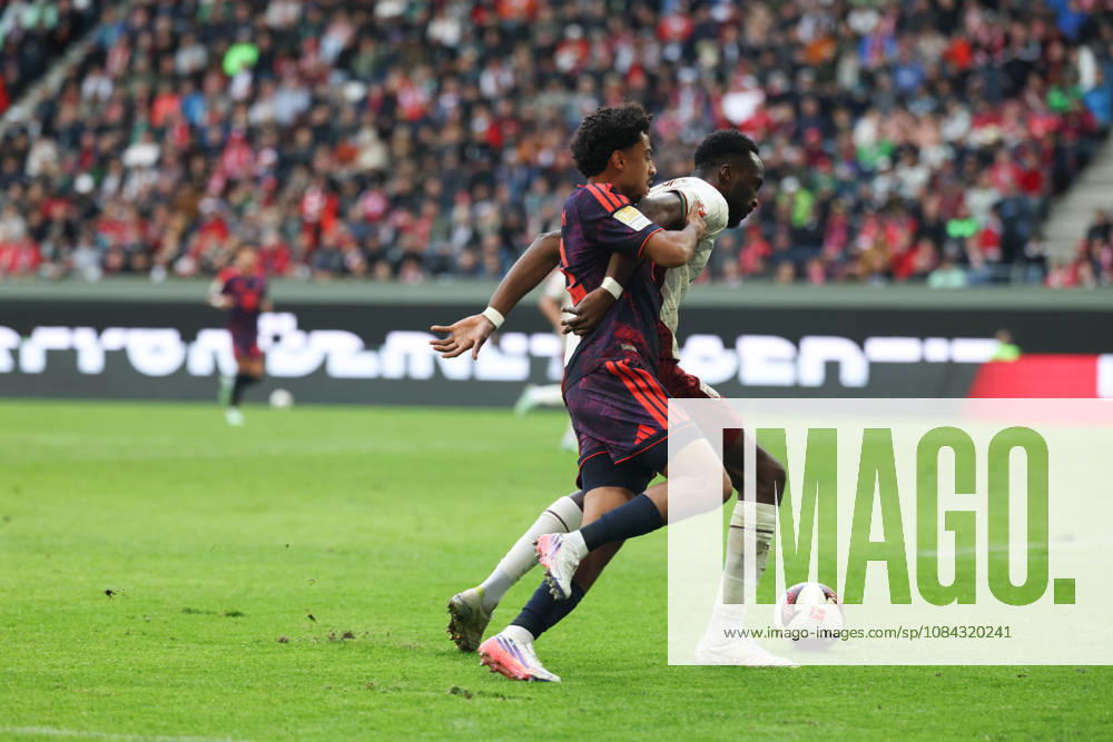 Nathaniel Brown, FC Bayern Munich, No. 11, with Chrislain Matsima, FC Augsburg, No. 05, GER, FC Augsburg vs. FC Bayern Munich, Soccer, Bundesliga, Matchday 5, 2026–2027 Season, October 10, 2026, DFL and DFB regulations prohibit any use of photographs as image sequences and or quasi-video, GER, FC Augsburg vs. FC Bayern Munich, Soccer, Bundesliga, Matchday 5, 2026–2027 season, October 10, 2026, Augsburg