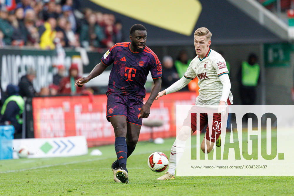 Dayot Upamecano 2, FC Bayern Munich, and Anton Kade 30, FC Augsburg, during the match between FC Augsburg and FC Bayern Munich, soccer, men s, Bundesliga, 2026–2027, Matchday 5 on October 10, 2026, in Augsburg, WWK ARENA. DFL and DFB regulations prohibit any use of photographs as image sequences and or quasi-video. Bayern, Germany