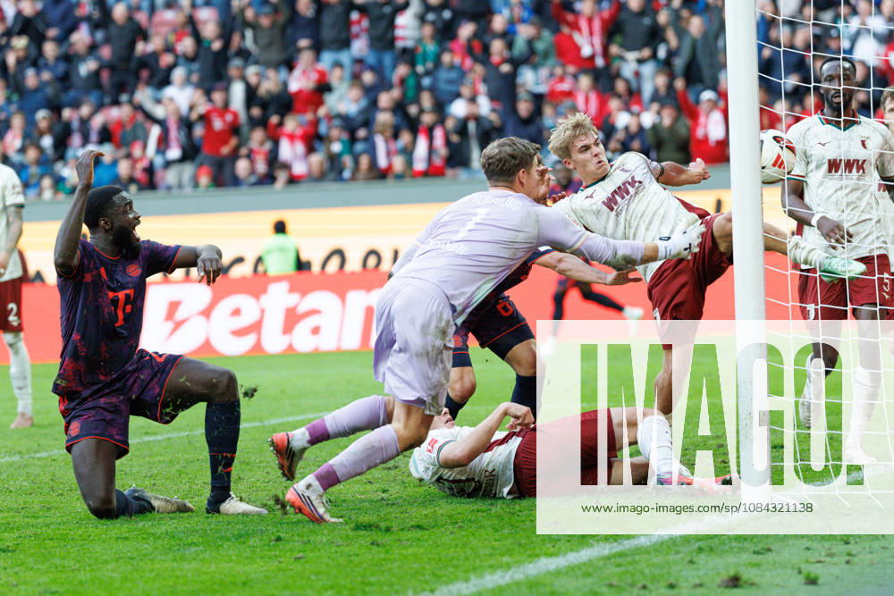 Hennes Behrens (16), FC Augsburg, and Finn Dahmen (1), FC Augsburg, make a save on the goal line during the match between FC Augsburg and FC Bayern Munich, soccer, men’s, Bundesliga, 2026–2027, Matchday 5 on October 10, 2026, in Augsburg, WWK ARENA. DFL and DFB regulations prohibit any use of photographs as image sequences and or quasi-video. Bavaria, Germany