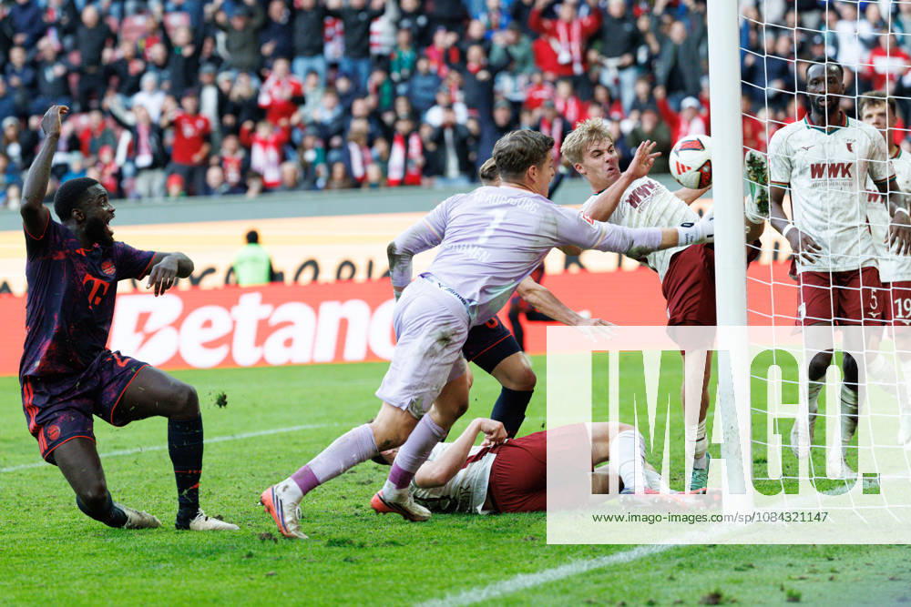 Hennes Behrens (16), FC Augsburg, and Finn Dahmen (1), FC Augsburg, make a save on the goal line during the match between FC Augsburg and FC Bayern Munich, soccer, men’s, Bundesliga, 2026–2027, Matchday 5 on October 10, 2026, in Augsburg, WWK ARENA. DFL and DFB regulations prohibit any use of photographs as image sequences and or quasi-video. Bavaria, Germany