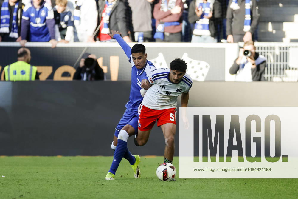 Adam Daghim of TSG Hoffenheim, 14, and Martin Adeline of Hamburger SV, 05, in a tackle, Germany, soccer, Bundesliga 1, Matchday 5, 2026–2027, TSG Hoffenheim vs. Hamburger SV, October 10, 2026, Sinsheim SNP Arena, Germany