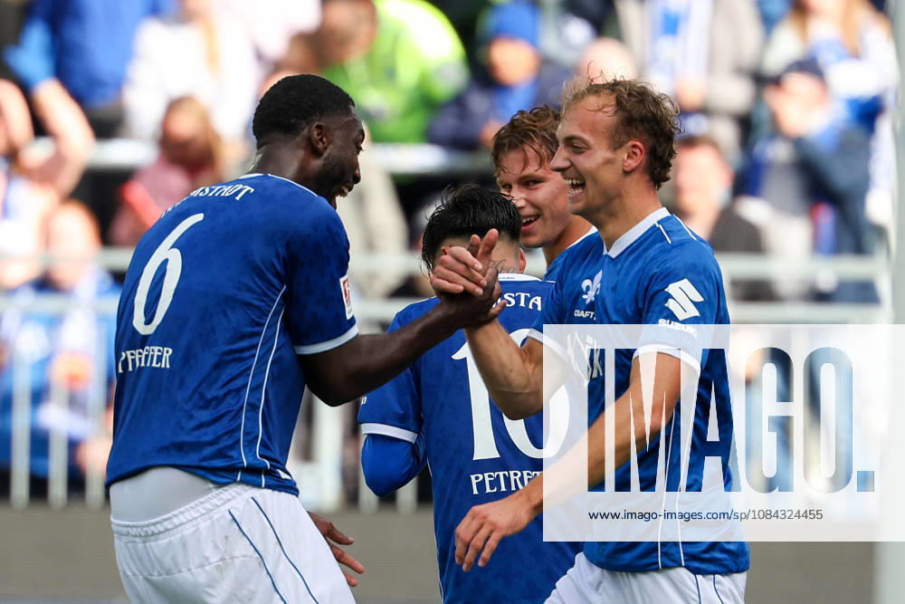 Soccer, 2. Bundesliga, SV Darmstadt 98 vs. Energie Cottbus; Patric Pfeiffer of SV Darmstadt 98 and Yannik Luehrs of SV Darmstadt 98 are seen celebrating after scoring a goal to make the score 3–1.