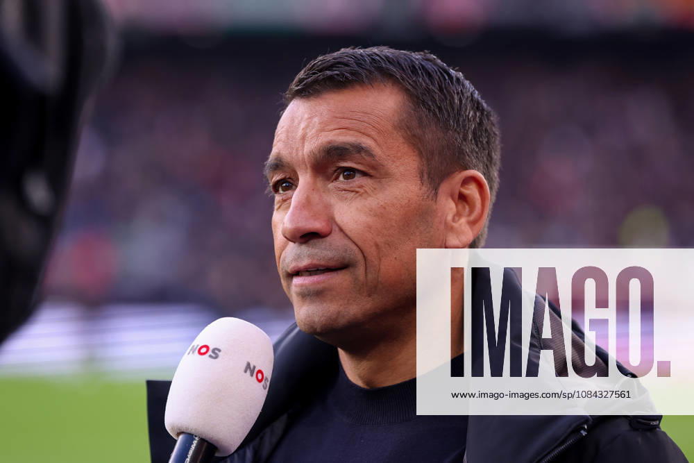 2026-10-10 Feyenoord v AZ Alkmaar - Dutch Eredivisie ROTTERDAM, NETHERLANDS - OCTOBER 10: Headcoach Giovanni van Bronckhorst of Feyenoord is interviewed by ESPN during the Dutch Eredivisie match between Feyenoord and AZ Alkmaar at Stadion Feijenoord on October 10, 2026 in Rotterdam, Netherlands. Rotterdam Stadion Feijenoord Netherlands Content not available for redistribution in The Netherlands directly or indirectly through any third parties.