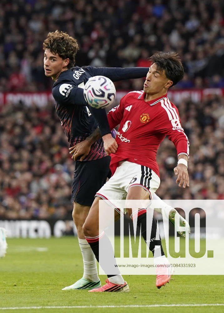 Manchester, England, 10th October 2026. Archie Gray of Tottenham tussles with Lisandro Martinez of Manchester United, ManU during the Manchester United vs Tottenham Hotspur Premier League match at Old Trafford, Manchester. Picture credit should read: Andrew Yates Sportimage . SPI_031_AY_MANUTD_SPURS SPI-5058-0031