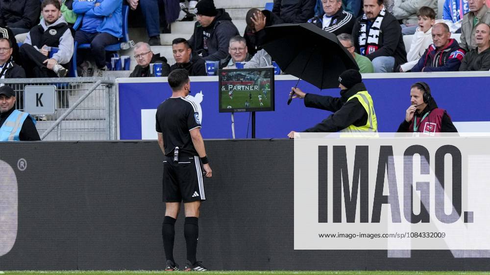 After the alleged 2-2 goal for HSV, referee Harm Osmers consults the Video Assistant Referee (VAR) for the second time; video evidence, video referee, video, play, action, game scene, October 10, 2026, Sinsheim, Germany, soccer, Bundesliga, TSG 1899 Hoffenheim, Hamburger SV, DFB and DFL regulations prohibit any use of photographs as image sequences and or quasi-video