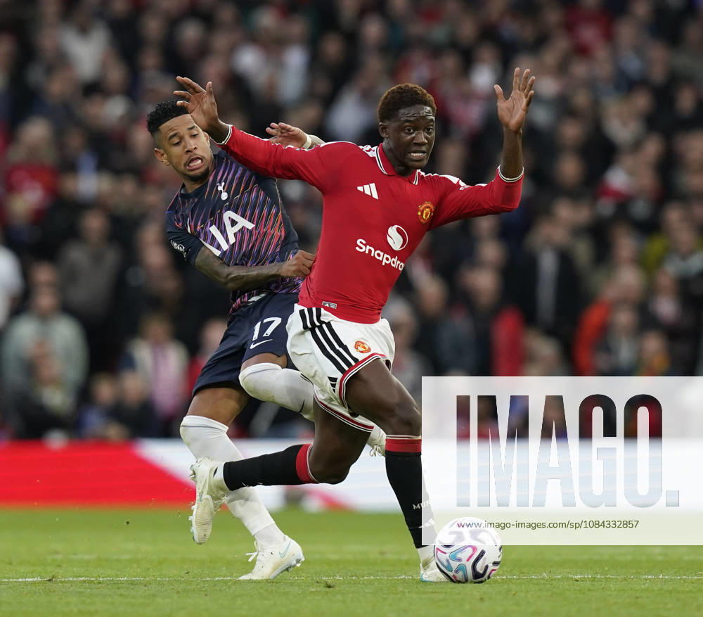 Manchester, England, 10th October 2026. Savio of Tottenham tackles Kobbie Mainoo of Manchester United, ManU during the Manchester United vs Tottenham Hotspur Premier League match at Old Trafford, Manchester. Picture credit should read: Andrew Yates Sportimage . SPI_039_AY_MANUTD_SPURS SPI-5058-0039