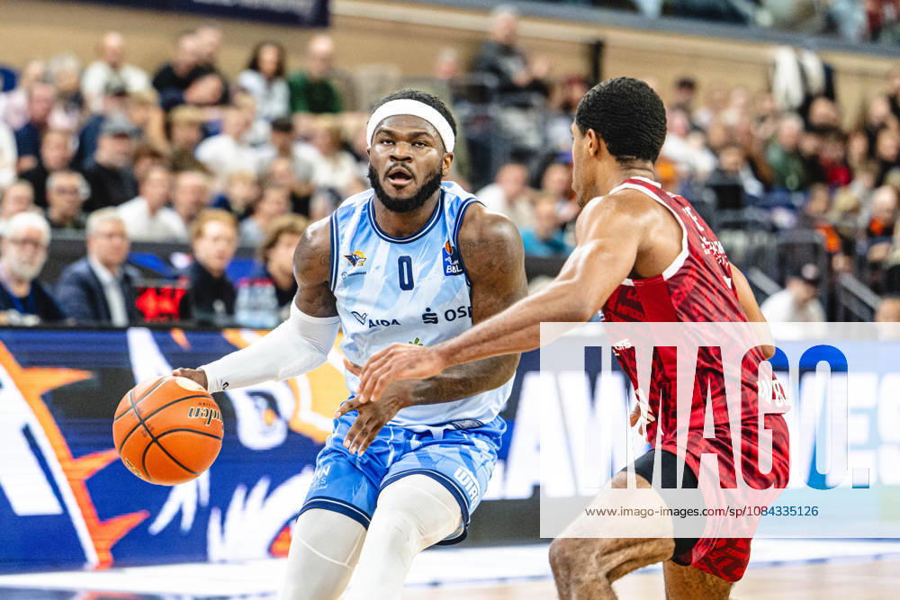 Rostock, Germany, October 10, 2026, easyCredit BBL 2026–2027, Game Day 5: Rostock Seawolves vs. Fitness First Würzburg Baskets. Pictured, from left, in a one-on-one matchup: TJ Crockett Jr. of the Rostock Seawolves and Kenny Dye of the Fitness First Würzburg Baskets.