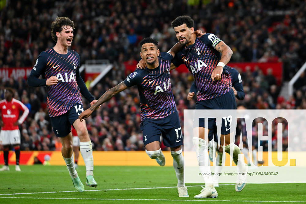 MANCHESTER, ENGLAND, OCT 10: Dominic Solanke (R) of Tottenham Hotspur celebrates with teammates Savio and Archie Gray (L) after scoring his sides first goal during the Premier League match between Manchester United, ManU and Tottenham Hotspur at Old Trafford in Manchester, England (Will Palmer Sports Press Photo)