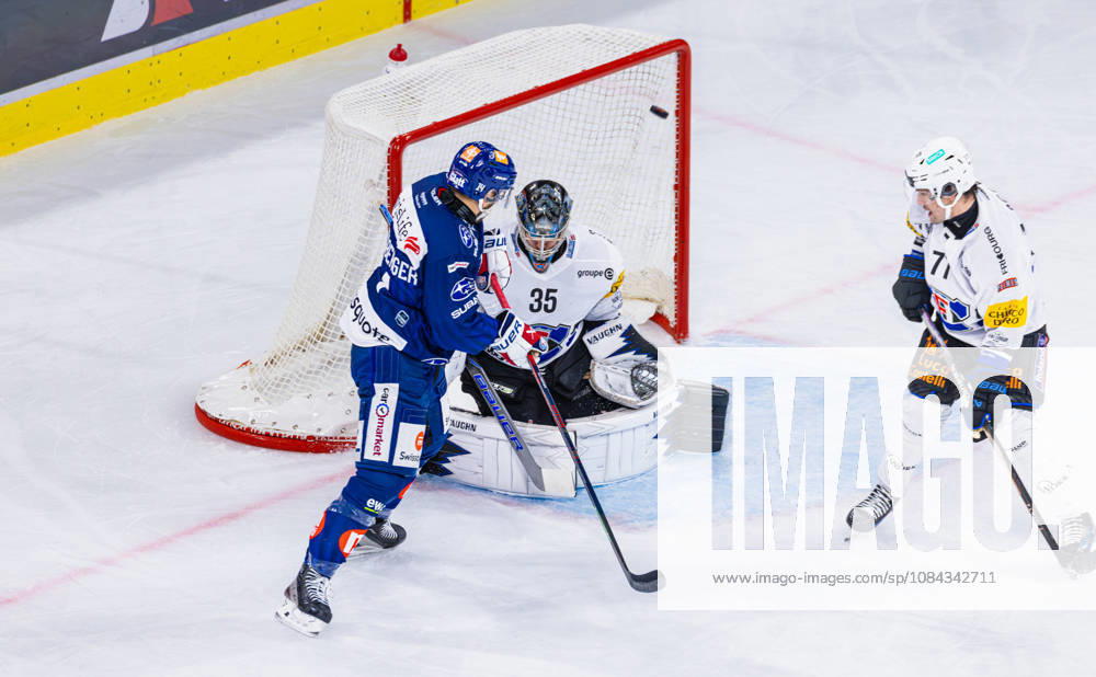 Ice Hockey National League Regular Season: ZSC Lions vs. HC Fribourg, Zurich, Switzerland, Oct. 10, 2026, 31st minute, 14 Chris Baltisberger of the ZSC Lions deflects the puck past goaltender 35 Ludovic Waeber of Fribourg to make it 4–3. Defenseman 7 Benoit Jecker of Fribourg has no chance.