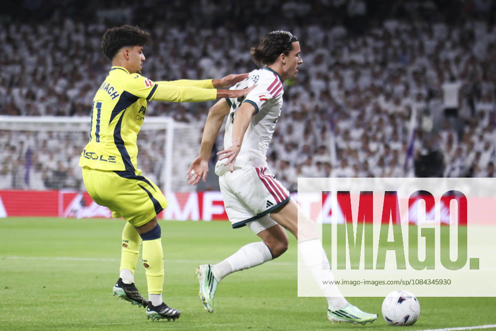 Real Madrid vs. Villarreal, La Liga EA Sports 2026, October 10, 2026, Santiago Bernabéu Stadium, Madrid, Spain Álvaro Carreras of Real Madrid shields the ball from Ilias Akhomach of Villarreal during a La Liga EA Sports match between Real Madrid and Villarreal at the Santiago Bernabéu Stadium on October 10, 2026, in Madrid, Spain Madrid Santiago Bernabéu Stadium Madrid Spain