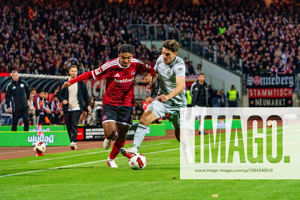 Rayan Ghrieb, 1. FC Nuremberg, 7, and Joakim Maehle, VfL Wolfsburg, 21, GER, 1. FC Nuremberg vs. VfL Wolfsburg, soccer, 2. Bundesliga, Matchday 7, 2026–2027 season, October 10, 2026, DFL regulations prohibit any use of photographs as image sequences and or quasi-video, GER, 1. FC Nuremberg vs. VfL Wolfsburg, Soccer, 2. Bundesliga, Matchday 7, 2026–2027 Season, October 10, 2026, Nuremberg