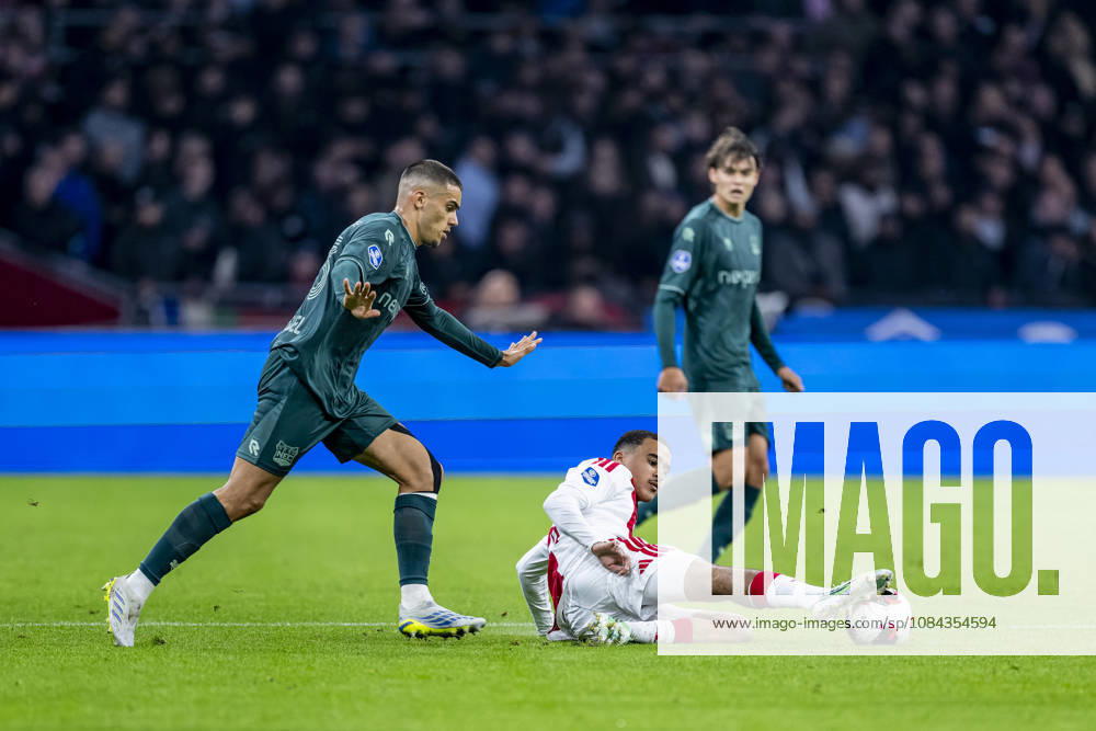 AMSTERDAM l NEC Nijmegen defender Gabriel Bras and AFC Ajax Amsterdam midfielder Abdellah Ouazane during the Vriendenloterij Eredivisie match between Ajax and NEC at the Johan Cruijff ArenA on October 10, 2026, in Amsterdam, Netherlands. Photo by DeFodi Images