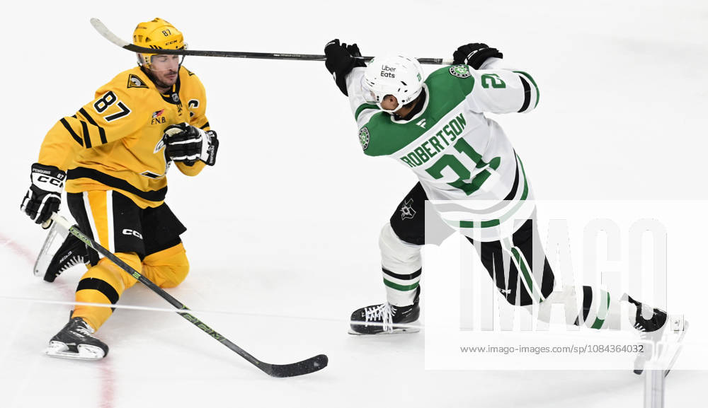 Dallas Stars left wing Jason Robertson (21) takes a shot pass Pittsburgh Penguins center Sidney Crosby (87) and records the assist on the goal that forces overtime at PPG Paints Arena in Pittsburgh on Saturday, October, 10 2026. The Pittsburgh Penguins went on to win 2-1 in a shootout. PIT2026101018 ARCHIExCARPENTER