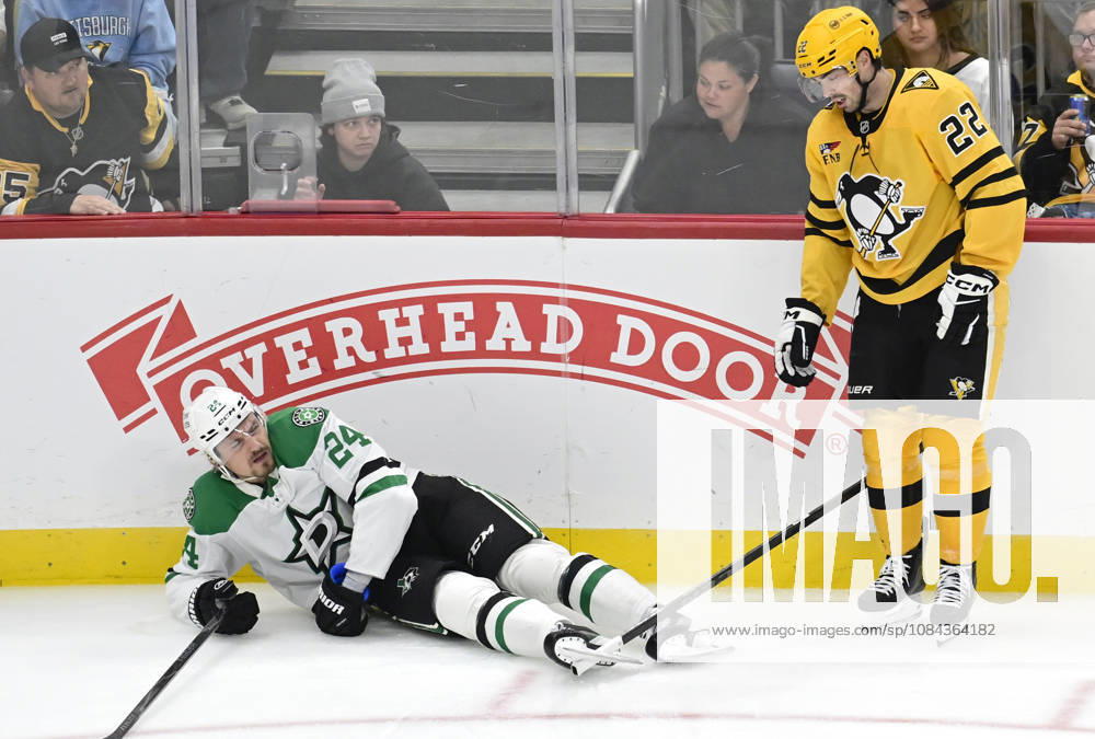 Pittsburgh Penguins center Hendrix Lapierre (22) receives a tripping penalty and looks at his stick caught in the blade of Dallas Stars center Roope Hintz (24) skate during the third period at PPG Paints Arena in Pittsburgh on Saturday, October, 10 2026. The Pittsburgh Penguins went on to win 2-1 in a shootout. PIT2026101022 ARCHIExCARPENTER