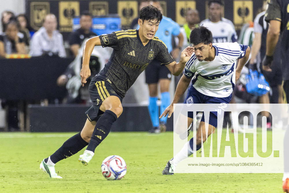 Los Angeles FC attacking midfielder Heung Min Son (7) and Vancouver Whitecaps centre back Mathias Laborda (2) vie for the ball during a MLS, Fussball Herren, USA soccer game on Saturday, Oct. 10, 2026 in Los Angeles. Los Angeles USA - ZUMAc68_ 20261010_zaf_c68_033
