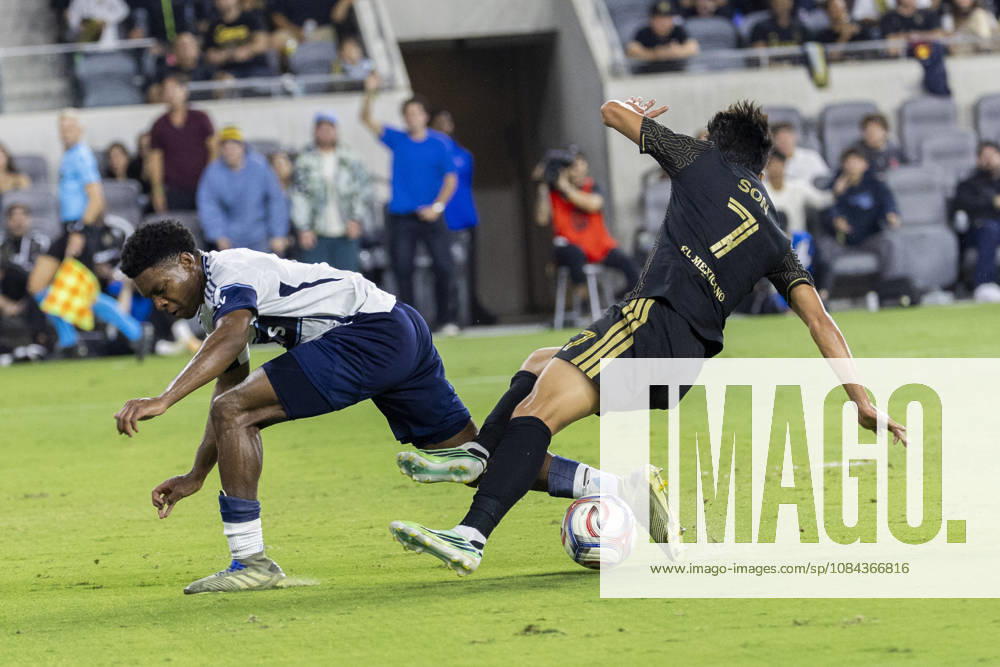 Los Angeles FC attacking midfielder Heung Min Son (7) and Vancouver Whitecaps centre back Ralph Priso (6) vie for the ball during a MLS, Fussball Herren, USA soccer game on Saturday, Oct. 10, 2026 in Los Angeles. Los Angeles USA - ZUMAc68_ 20261010_zaf_c68_056
