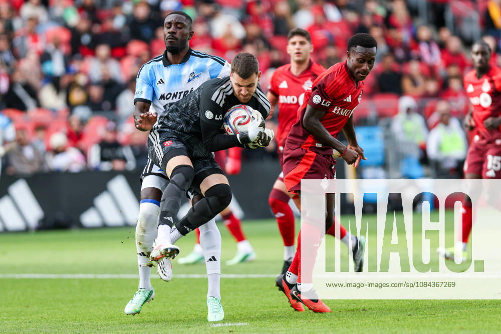 Toronto FC v CF Montreal Luka Gavran 1 of Toronto FC (center) throws himself to collect the ball from Prince Owusu 9 of CF Montreal (left) and Richie Laryea 22 of Toronto FC (right) during a Major League Soccer game between Toronto FC and CF Montreal at BMO Field in Toronto, Ontario, Canada, on October 10, 2026. Toronto Ontario Canada