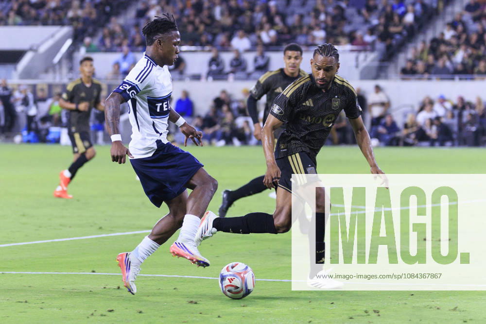 Edier Ocampo 18 of the Vancouver Whitecaps attempts to cross the ball as Eddie Segura 4 of the Los Angeles Football Club defends during their regular season MLS, Fussball Herren, USA game on Saturday October 10, 2026 at the BMO Stadium in Los Angeles, California. LAFC tie with Whitecaps, 1-1. ARIANA RUIZ PI Los Angeles USA - ZUMAp124 20261010_zaa_p124_023