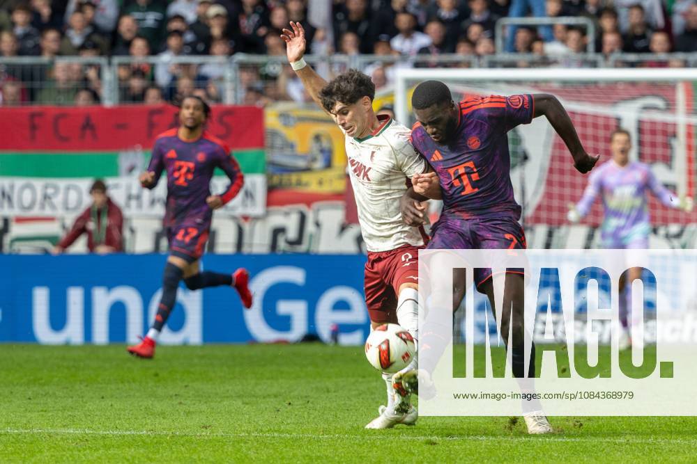 Rodrigo Ribeiro (FC Augsburg) and Dayot Upamecano (FC Bayern Munich) in a tackle, FC Augsburg vs. FC Bayern Munich, Bundesliga, Soccer, Bundesliga 1, Matchday 5, October 10, 2026. DFL regulations prohibit any use of photographs as image sequences and or quasi-video.