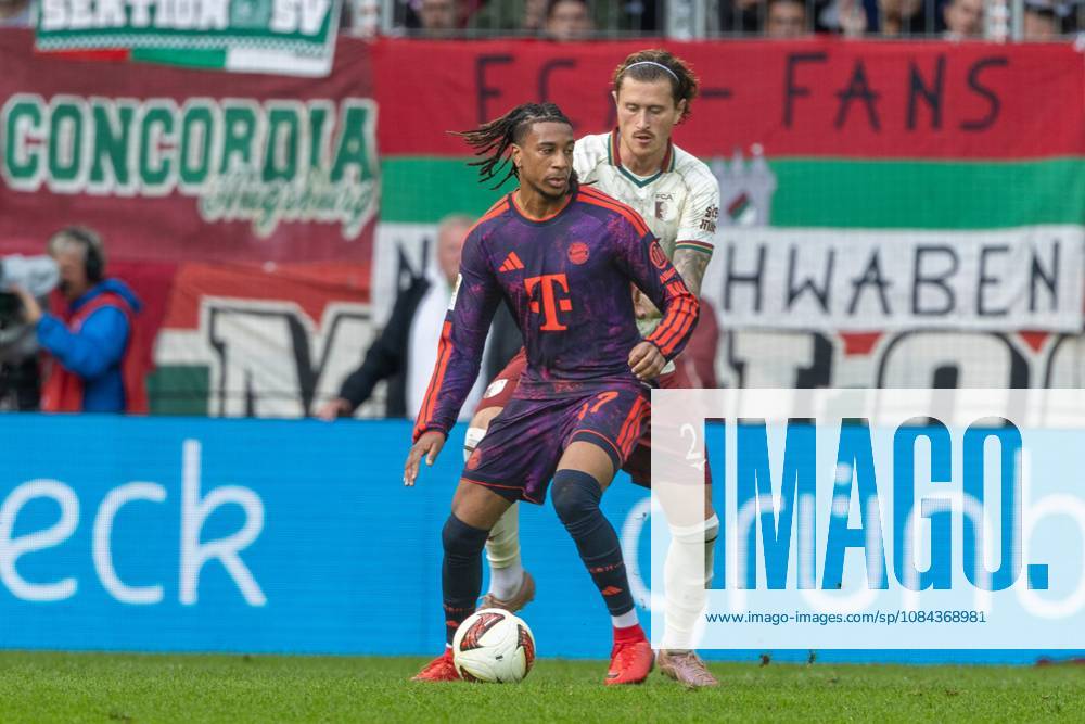 Michael Olise of FC Bayern Munich and Calvin Brackelmann of FC Augsburg in a one-on-one duel, FC Augsburg vs. FC Bayern Munich, Bundesliga, Soccer, Bundesliga 1, Matchday 5, October 10, 2026. DFL regulations prohibit any use of photographs as image sequences and or quasi-video.