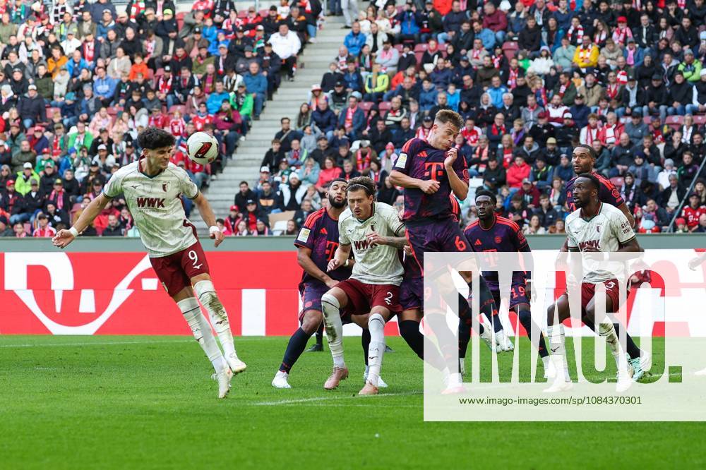 One-on-one, action, featuring Rodrigo Ribeiro 9 (FC Augsburg), Calvin Brackelmann 2 (FC Augsburg), Joshua Kimmich 6 (FC Bayern Munich), Chrislain Matsima 5 (FC Augsburg), FC Augsburg vs. FC Bayern Munich, soccer, Bundesliga 1, Matchday 5, October 10, 2026. DFB and DFL regulations prohibit any use of photographs as image sequences and or quasi-video. Augsburg, Bayern, Germany