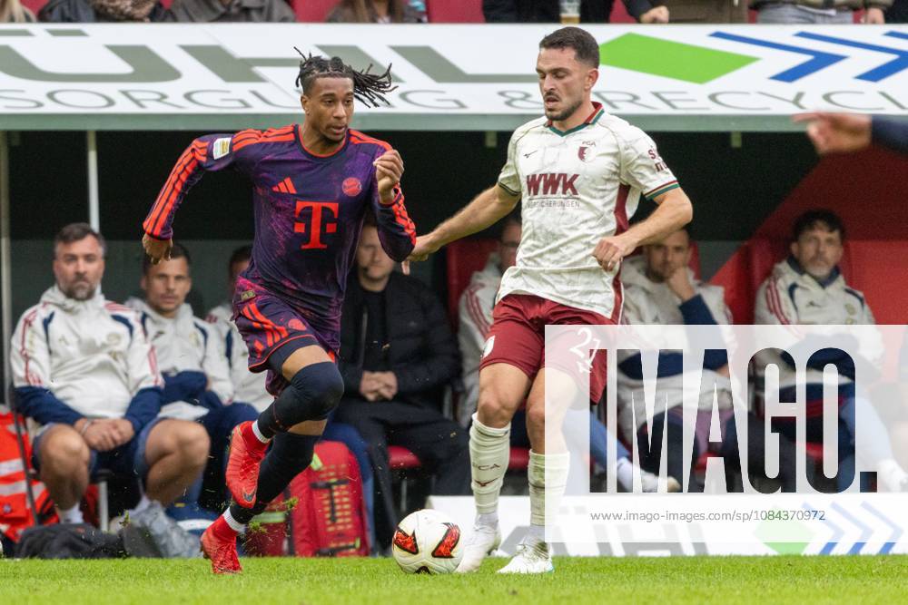 Michael Olise of FC Bayern Munich and Arijon Ibrahimovic of FC Augsburg in a one-on-one duel, FC Augsburg vs. FC Bayern Munich, Bundesliga Soccer, Soccer, Bundesliga 1, Matchday 5, October 10, 2026. DFL regulations prohibit any use of photographs as image sequences and or quasi-video.
