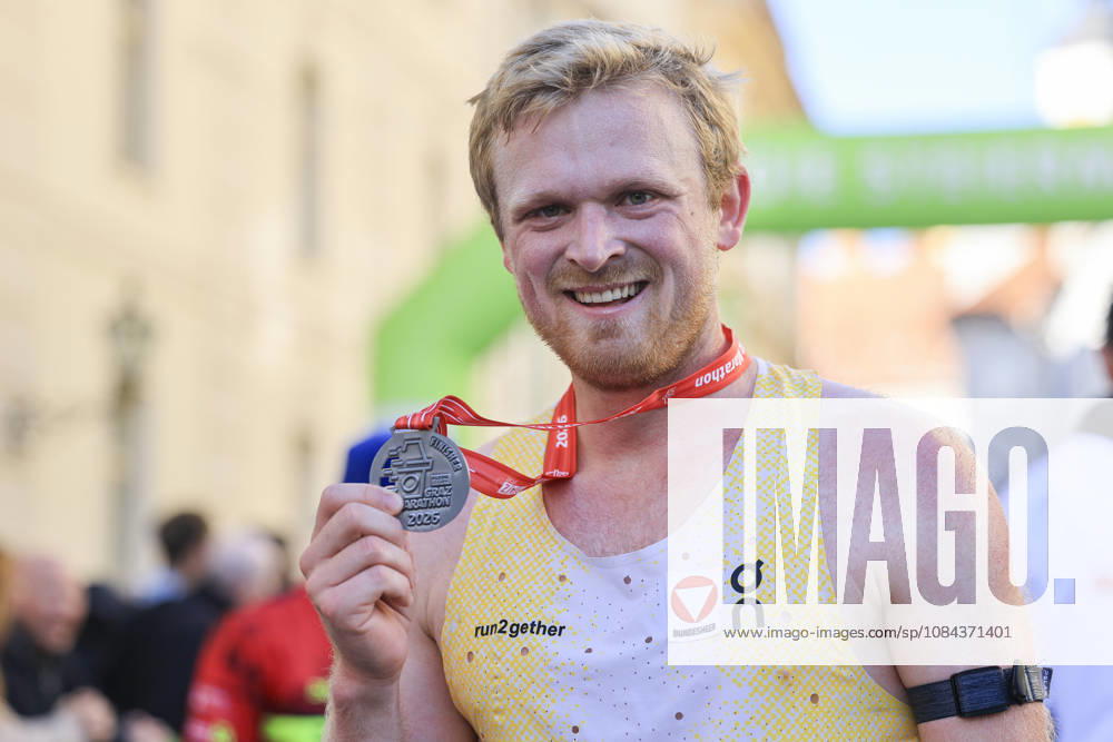 RUNNING - Graz Marathon 2026 GRAZ,AUSTRIA,11.OCT.26 - RUNNING - Graz Marathon. Image shows the rejoicing of Leo Holper. Keywords: medal. GEPAxpictures xWolfgangxGrebien