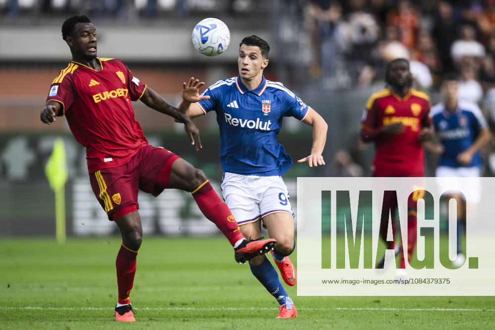 Como 1907 v AS Roma - Serie A Evan Ndicka of AS Roma competes for the ball with Tasos Douvikas of Como 1907 during the Serie A football match between Como 1907 and AS Roma. Como Italy