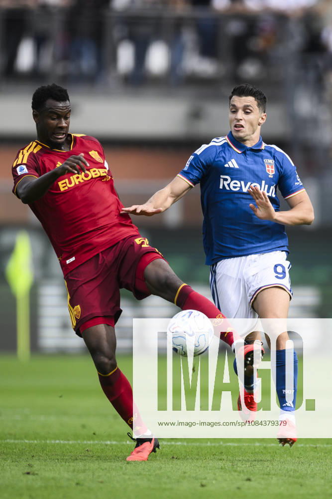 Como 1907 v AS Roma - Serie A Evan Ndicka of AS Roma competes for the ball with Tasos Douvikas of Como 1907 during the Serie A football match between Como 1907 and AS Roma. Como Italy