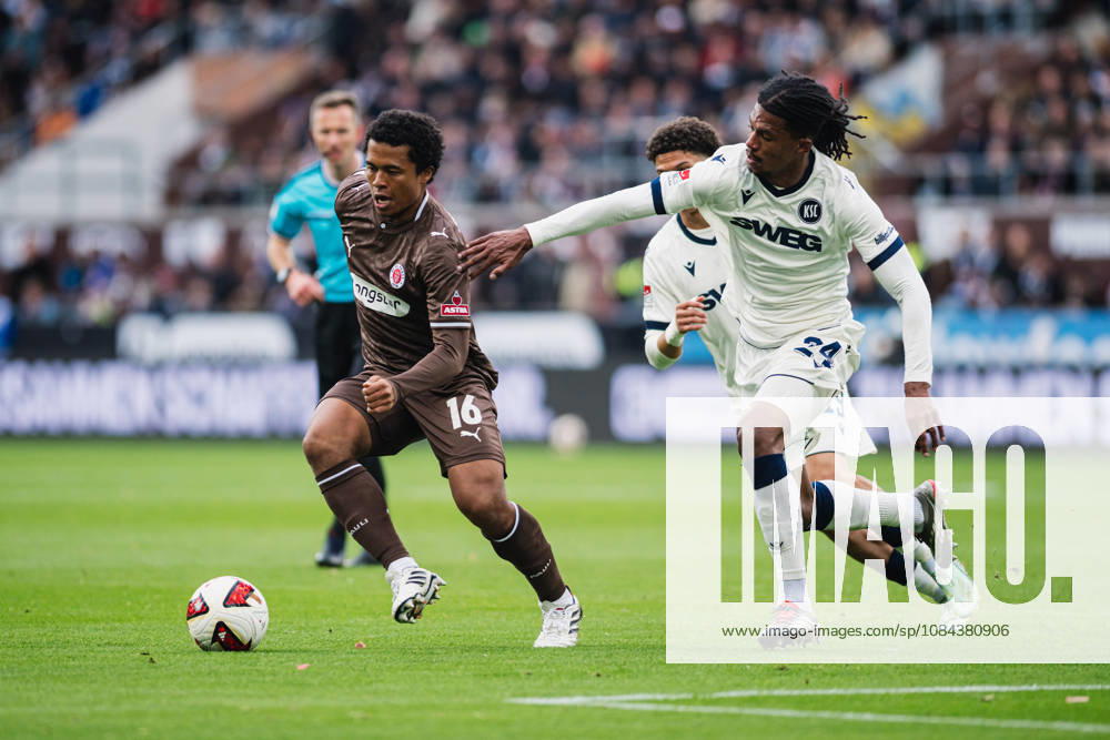 2. Bundesliga: FC St. Pauli vs. Karlsruher SC, October 11, 2026; Joel Fujita (FC St. Pauli, No. 16) vs. Sandro Tromoulet (Karlsruher SC, No. 24); Soccer, 2. Bundesliga, Matchday 7: FC St. Pauli vs. Karlsruher SC on October 11, 2026, at Millerntor Stadium, Hamburg. DFL regulations prohibit any use of photographs as image sequences and or quasi-video.
