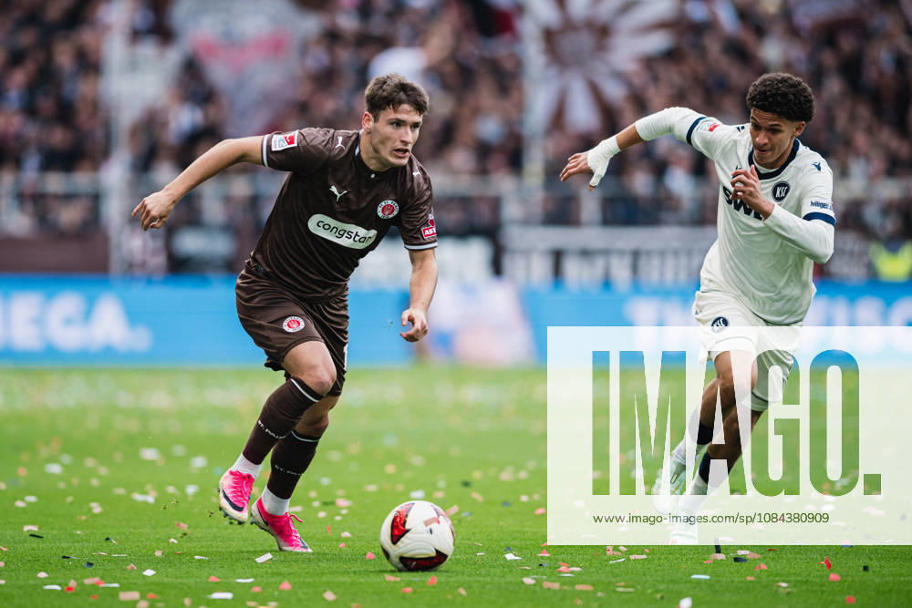 2. Bundesliga: FC St. Pauli vs. Karlsruher SC, October 11, 2026; Arkadiusz Pyrka (FC St. Pauli), No. 11, vs. Louey Ben Farhat (Karlsruher SC), 19 Soccer, 2. Bundesliga, Matchday 7: FC St. Pauli vs. Karlsruher SC on October 11, 2026, at Millerntor Stadium, Hamburg. DFL regulations prohibit any use of photographs as image sequences and or quasi-video.