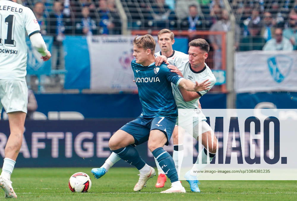 Germany Soccer 2. Bundesliga 2026–2027, Matchday 7: VfL Bochum vs. Arminia Bielefeld at Vonovia Ruhrstadion in Bochum—Christian Rasmussen (VfL Bochum) and Marius Wörl (Arminia Bielefeld) in a tackle, 38
