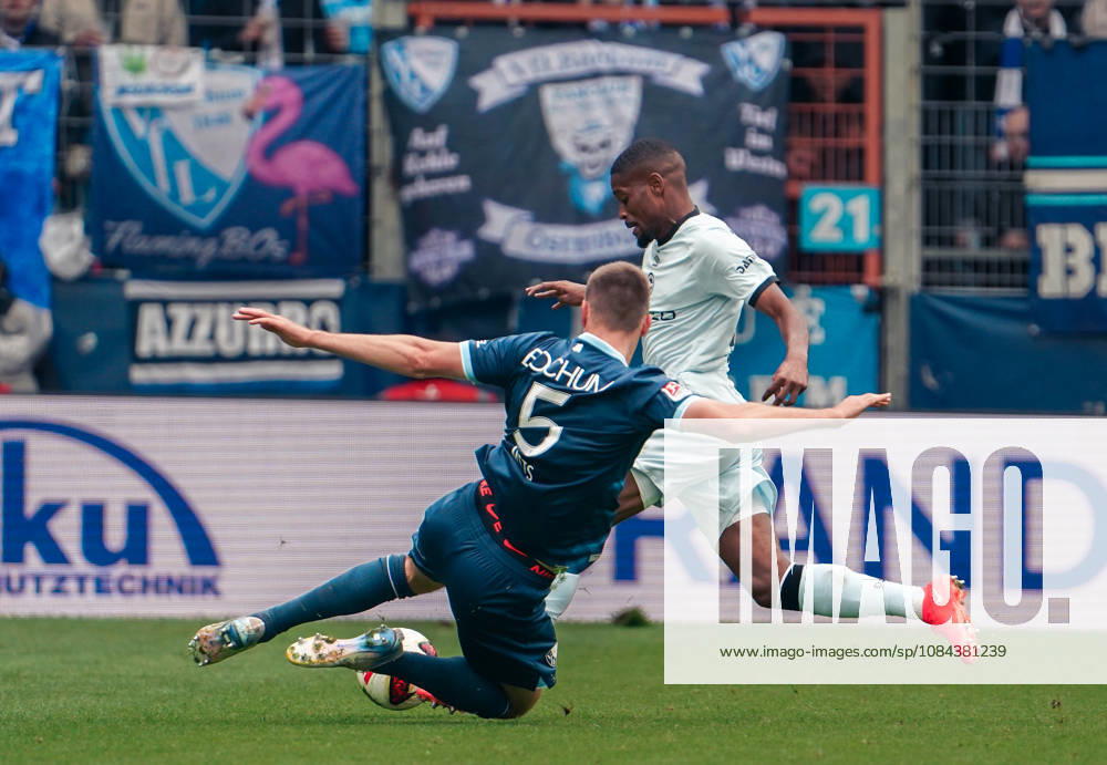 Germany Soccer 2. Bundesliga 2026–2027, Matchday 7: VfL Bochum vs. Arminia Bielefeld at Vonovia Ruhrstadion in Bochum; Tackle by Karol Mets (VfL Bochum), 5; Isaiah Young (Arminia Bielefeld), 30