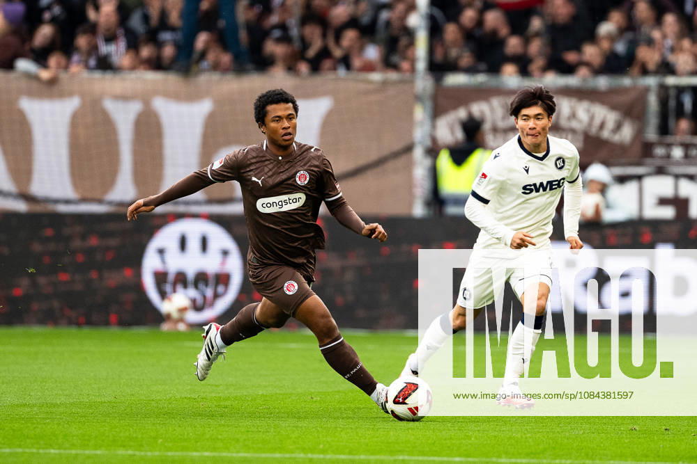 Joel Chima Fujita, FC St. Pauli, No. 16, dribbling; Shio Fukuda, Karlsruher SC, No. 13, GER; FC St. Pauli vs. Karlsruher SC, soccer, 2. Bundesliga, Matchday 7, 2026–2027 season, October 11, 2026 DFL regulations prohibit any use of photographs as image sequences and or quasi-video, GER, FC St. Pauli vs. Karlsruher SC, soccer, 2. Bundesliga, Matchday 7, 2026–2027 season, October 11, 2026, Hamburg