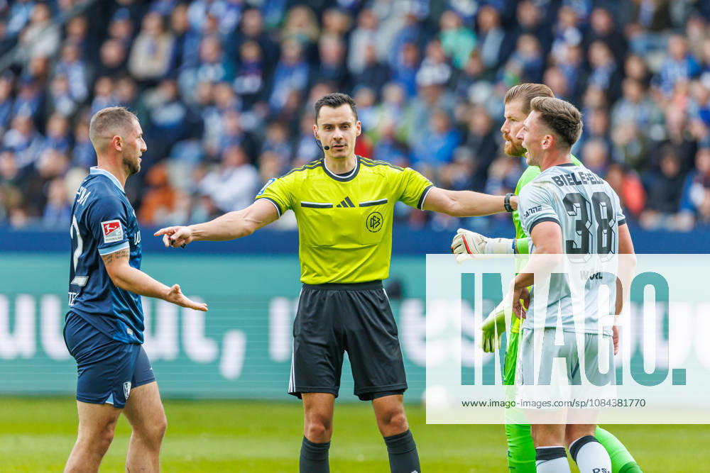Maximilian Wittek of VfL Bochum, referee Konrad Oldhafer, and Marius Woerl of DSC Arminia Bielefeld are discussing the game during the 2. Bundesliga match between VfL Bochum and Arminia Bielefeld, at the Ruhrstadion on October 11, 2026, in Bochum, Germany. Photo by Mario Hommes, DeFodi Images. Maximilian Wittek of VfL Bochum, referee Konrad Oldhafer, and Marius Woerl of DSC Arminia Bielefeld discuss during the 2. Bundesliga match between VfL Bochum and Arminia Bielefeld at Vonovia Ruhrstadion on October 11, 2026 in Bochum, Germany. Photo by Mario Hommes, DeFodi Images. DFB and DFL regulations prohibit any use of photographs as image sequences and or quasi-video. Photo by Mario Hommes, DeFodi Images.